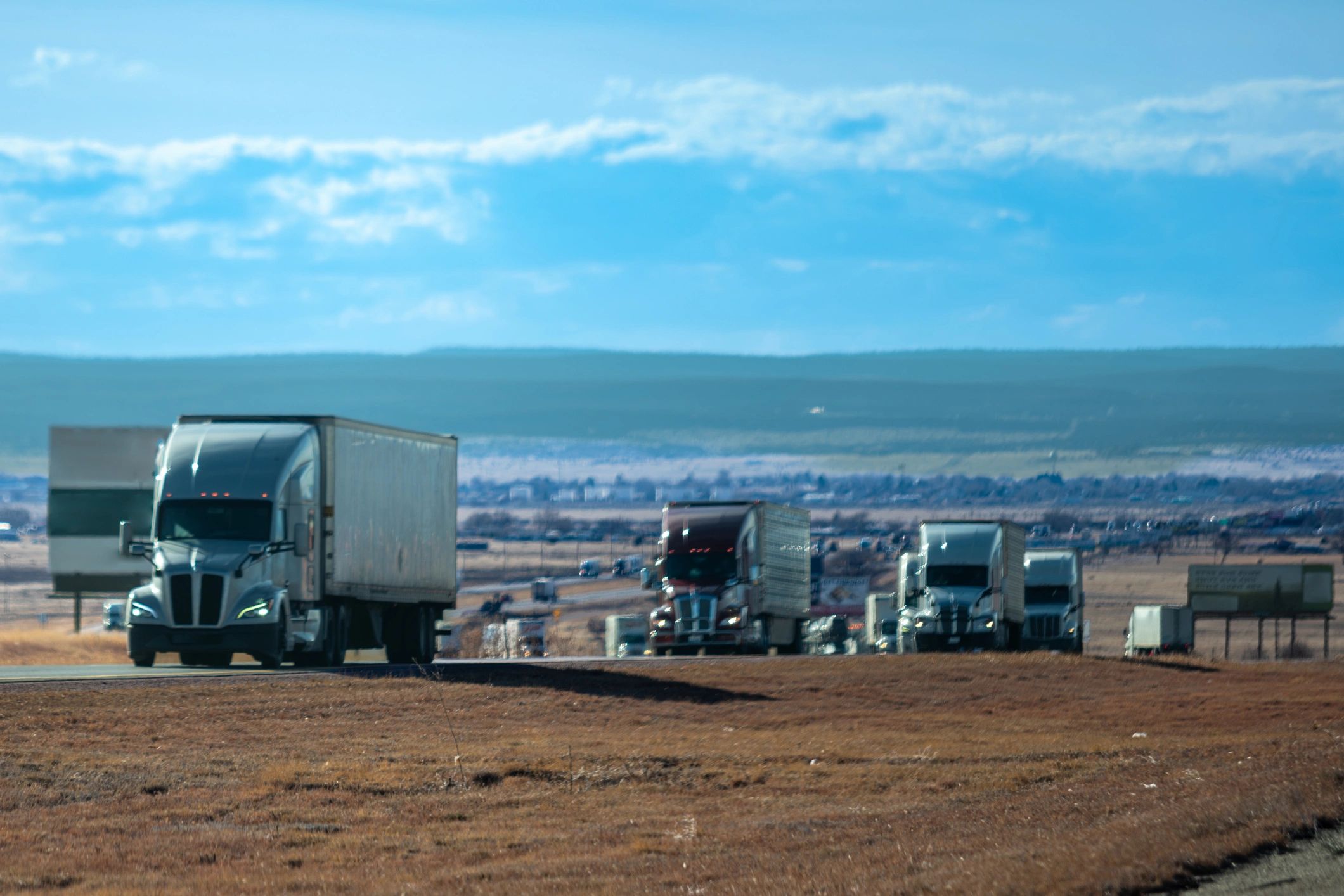 Commercial freight trucks representing logistics clients and transport operations